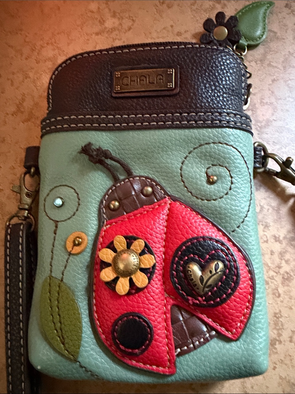 Chala Crossbody Bag with Red Ladybug Applique on Mint and Brown